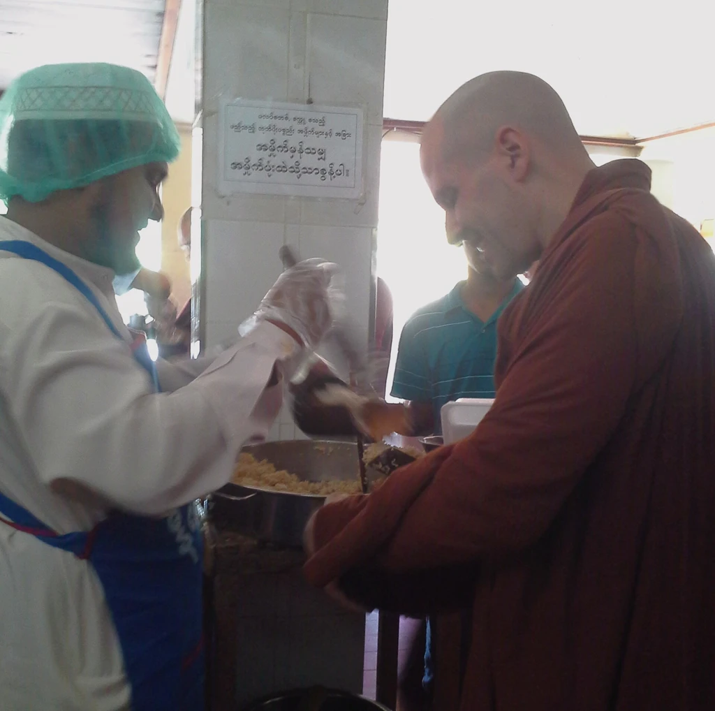Muslim Imam serving rice at Pa-Auk Forest Monastery on behalf of U Subhuti's Family.